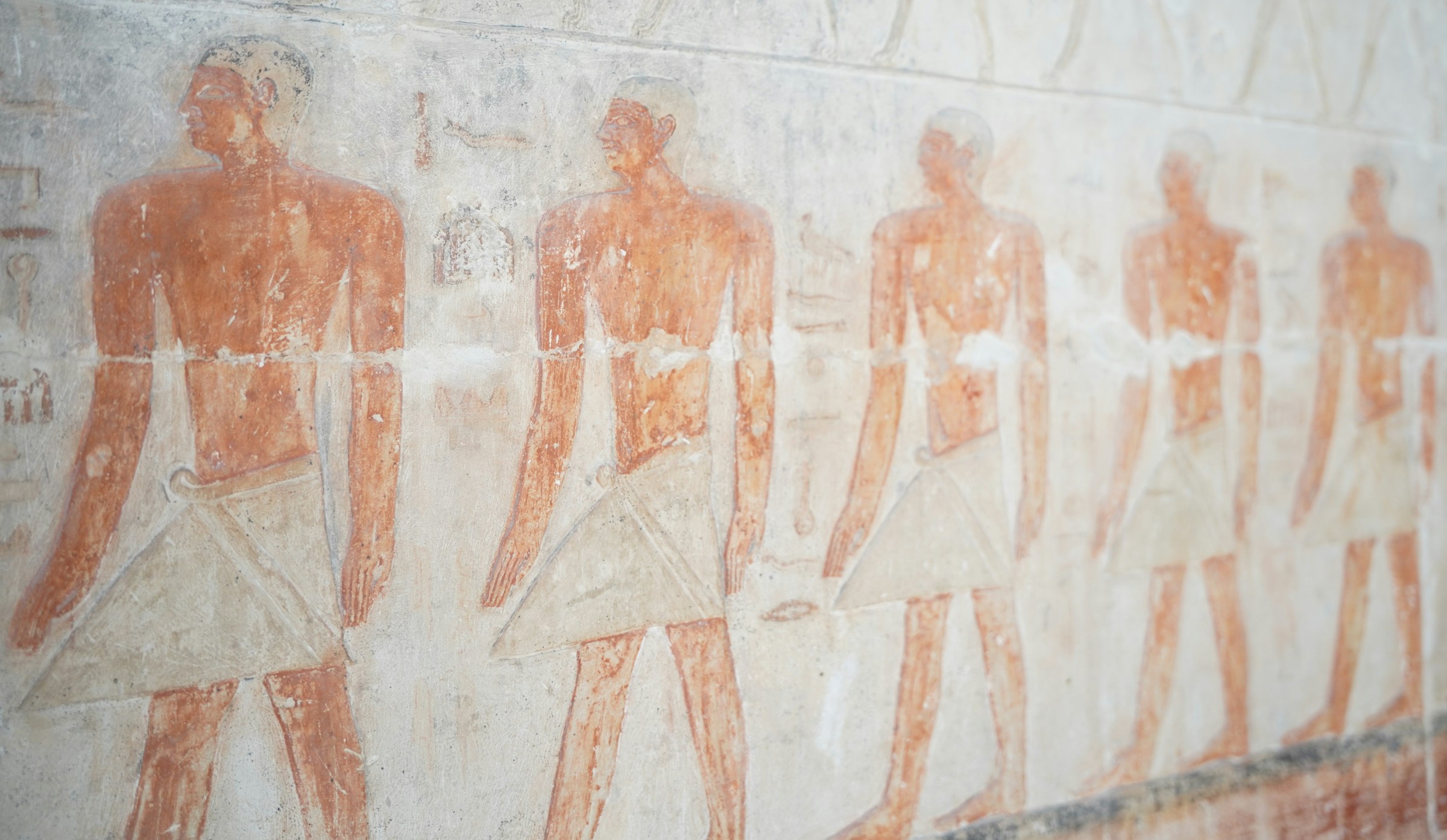 Painted wall figures showing scenes of daily life in the Saqqara necropolis